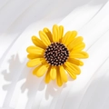 Detailed macro view of yellow sunflower brooch with textured petals and brown center - Yellow Little Daisy