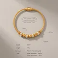 Gold-plated titanium steel cable bangle with crystal-studded beads, model Z277 - Gold Color Bangle (Z277)