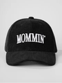 Detailed view of the MOMMIN' embroidery on premium black corduroy baseball cap texture - Adjustable / Black