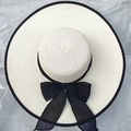 Chic beige wide brim straw hat with a large black ribbon bow for summer beach sun protection - Cream With Black Ribbon / 56-60cm