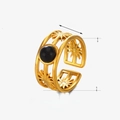 Gold stainless steel ring featuring a black round gemstone and hollow star patterns - Obsidian