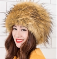 Close-up of fluffy faux fox fur texture on a warm Russian style winter cossack hat - Tan