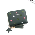 Detail of dark green coin purse featuring heart embroidery and tassel star charm - Green