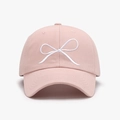 Pink cotton baseball cap featuring white bow embroidery and curved brim style - Pink