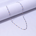 Macro detail of gold-plated stainless steel chain with blue enamel olive leaf charms - Gold Tone + Royal Blue / 40+5cm