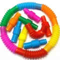 Rainbow plastic pop tubes shown in a colorful circular arrangement on white background - 1.9*6cm Small Pop Tube