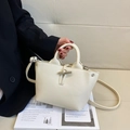 Chic beige lychee leather tote bag with iconic metallic bamboo toggle buckle closure - Small / White