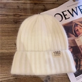 Minimalist cream white knit beanie with vintage California 1982 label on ribbed fabric - M / White