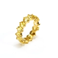 Detail of 18K gold eternity ring featuring a full circle of round cut yellow zircons - Gold Yellow Zirconia