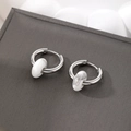 Detail of silver stainless steel hoop earrings with white marble stone charms - White Natural Stone