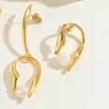 Detailed view of golden irregular metal frame earrings with white baroque pearls - Geometric Baroque Pearl Earrings
