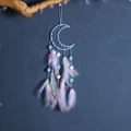 Blue moon-shaped dream catcher with feathers and pom-poms for girl's room decor - Blue Moon