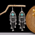 Detail of silver bohemian earrings with blue turquoise and metal tassel fringe charms - E2870-10/Teardrop Turquoise Long Tassel Bell
