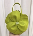 Detail of the green 3D floral petal tote bag showing the textured leather and center stamen - Kiwi Green