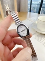 Close-up of minimalist silver oval quartz watch with white dial and elastic metal band - Silver Band White Dial