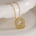 Gold letter Q pendant necklace with sparkling cubic zirconia on white background - Letter Q (Box Chain)