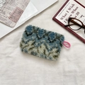 Fuzzy plush storage pouch in blue and grey patchwork with pink pull tab on white fabric - Rhombus Green Grid