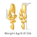 Detail showing the 4.2cm length and 1.55cm width of these multi-heart golden earrings - Triple Heart Linear Dangle Earrings
