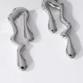 Minimalist liquid metal geometric earrings with silver mirror finish on a white stand - 14k / Silver