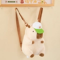 Close-up of plush Capybara backpack with a green cap hanging on a wall hook - Large White / Large 37cm