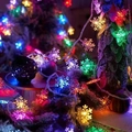 Solar outdoor LED string lights with multi-colored snowflake-shaped bulbs for gardens - Snowflake (Multicolor)