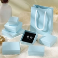 Light blue jewelry gift box set with silver foil accents and matching luxury paper bags - Sky Blue