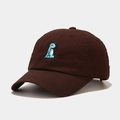 Close-up of small blue dinosaur embroidery on deep brown cotton twill baseball cap - M (56-58cm) / Brown