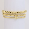 Set di tre bracciali con perline dorate e ciondolo rotondo con lettera K - Lettera K