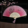 Pink and purple gradient Chinese folding fan with floral patterns and pink silk tassel - Spirit of the Waves (Heat Transfer)