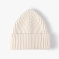 Chic off-white thick knit beanie with vertical ribbed pattern for winter warmth - Cream