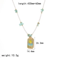 Detalle del collar con colgante de sol, piedras verdes y medidas técnicas en mm - Estilo de Colgante de Sol (TN3541)