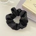 Close-up of premium black satin scrunchie with silky texture and elegant pleats - No Card / Black