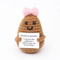 Handmade crochet positive potato doll with pink bow and motivational sign on white back - Dark Brown Potato Double Bow V-Mouth with Positive Card