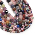 Macro detail of faceted natural stone beads in assorted colors for jewelry making - Multi Gemstone