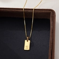 Elegant gold square pendant necklace featuring letter S engraving on velvet jewelry box - Letter S / Gold