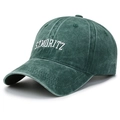 Washed cotton baseball cap in dark green featuring white ST. MORITZ embroidery - Army Green