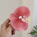 Pink floral hair claw clip featuring a centered white pearl accent for women - Peach Pink Orchid