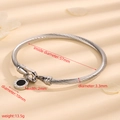 Zilveren roestvrijstalen kabelarmband met ronde hanger voorzien van Romeinse cijfers - Kabel Zilver Zwarte Schelp Romeins Cijfer Hanger