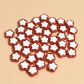 Macro shot of 10mm flower-shaped mixed color beads for DIY jewelry making and crafts - Red
