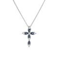 Macro view of cross pendant necklace featuring pear-cut blue crystals in silver setting - Silver Blue Zirconia