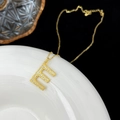 Elegant gold S925 silver necklace featuring a letter E pendant with cubic zirconia stones - Letter E
