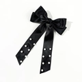 Detail of black satin ribbon bow hair clip with elegant pearl embellishments - Black