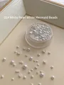 White mermaid pearl nail art beads in various sizes displayed in a transparent round box - Pearl White Mermaid Beads Mixed approx 3g Boxed [Australian White]