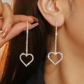 Sparkling silver heart drop earrings with luxury pave zircons worn by model - Silver White Rhinestone Long Dangle Earrings (DTE1316630S-W)