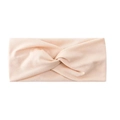 Close-up detail shot of the soft pink twisted athletic headband, elastic fabric texture. - Off White