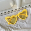 Fashionable heart-shaped yellow sunglasses with vibrant frames and matching lenses - Slanted Heart Yellow