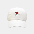Detailed close-up of intricate red rose embroidery on a classic white cotton baseball cap - Adjustable / White