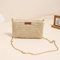 Elegant beige straw crossbody bag with golden chain strap for summer beach vacations - Off White