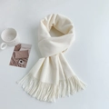 Detailed texture of white cashmere-like scarf featuring soft tassels and minimalist style - Regular Fit / Pure White