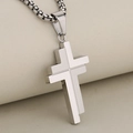 Polished silver stainless steel layered cross pendant necklace on a beige textured background - Silver (Pendant Only)